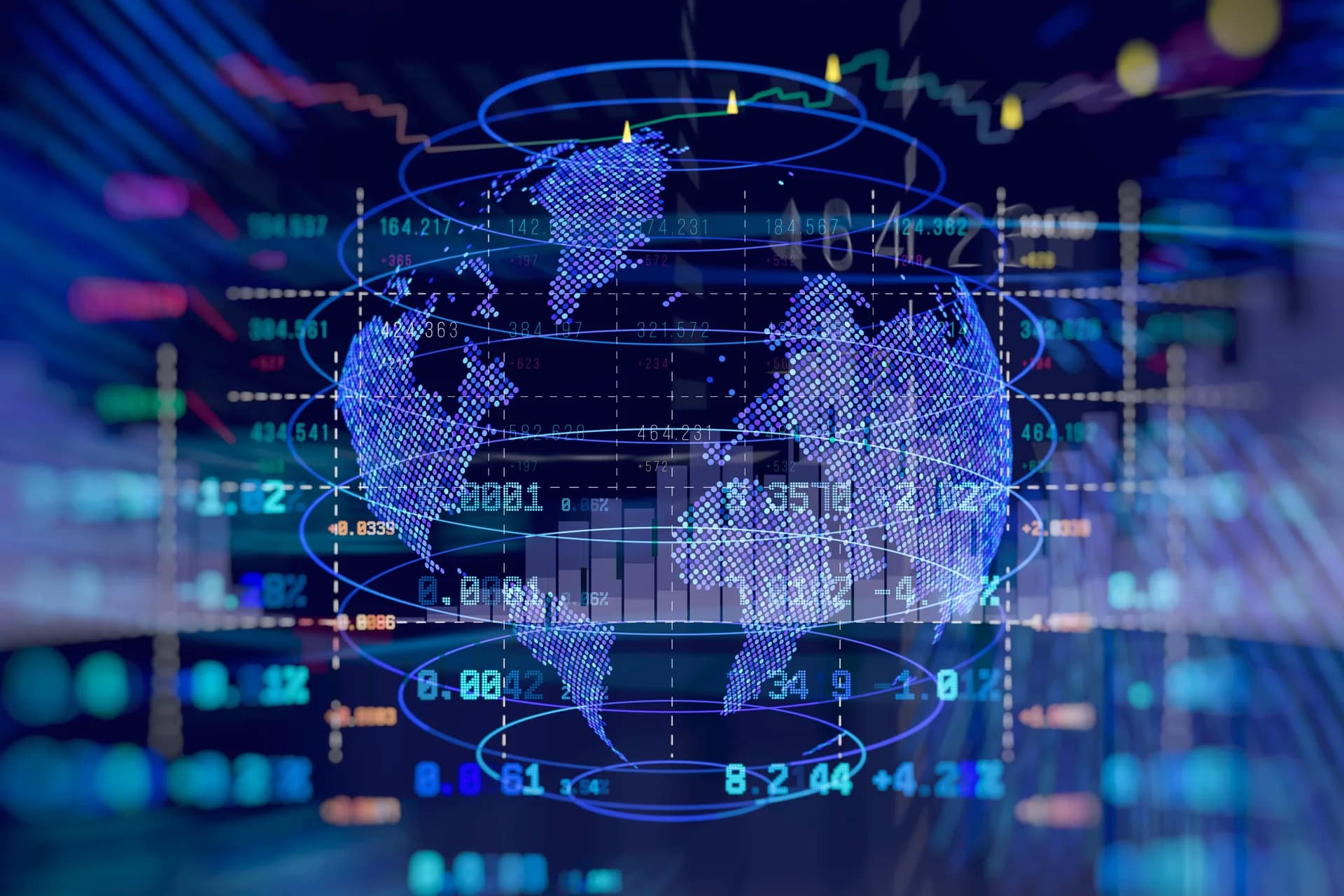 Trading floor analyst working at multiple monitors at night